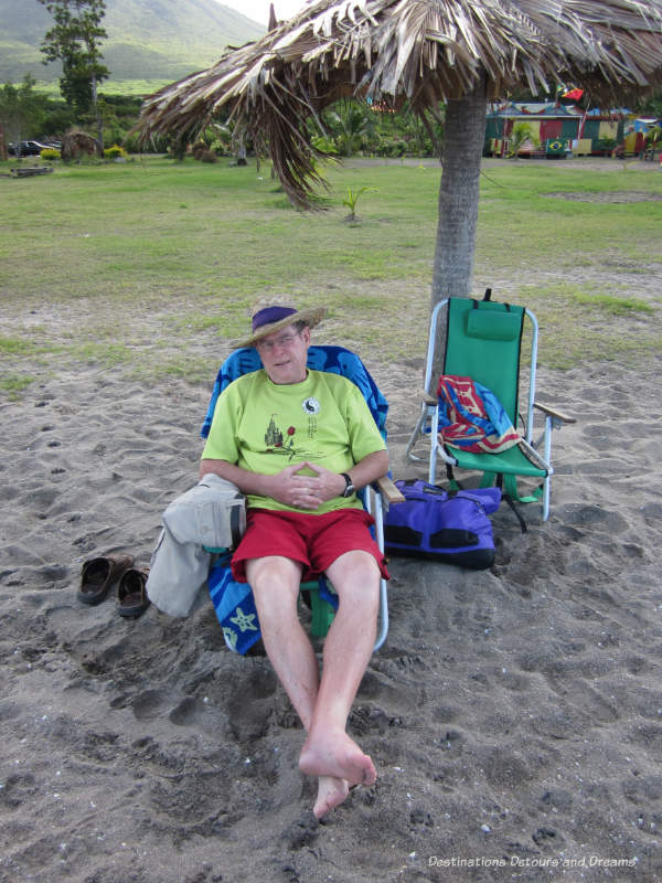 Sitting in a chair on the beach in Nevis