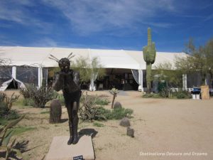 Kristofer Voss sculpture in foreground of sculpture garden at Arizona Fine Art Expo