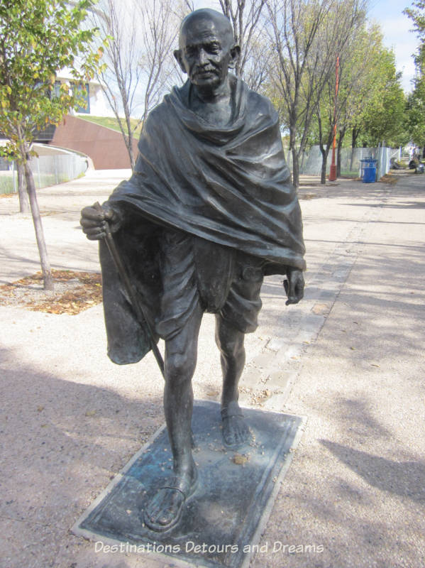 Gandhi statue in front of CMHR. The architecture of the Canadian Museum for Human Rights give physical shape to the idea of an upward journey in the struggle for human rights. Winnipeg, Manitoba