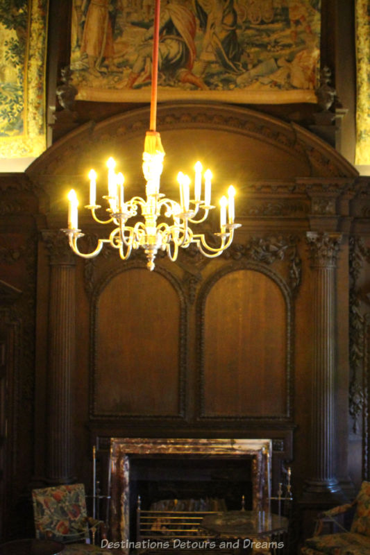 Dark wood screen from a Christopher Wren church in central hall at Polesden Lacey