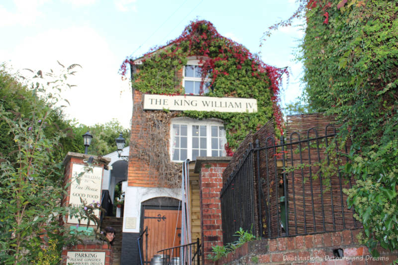 Ivy-covered two-story brick English country pub