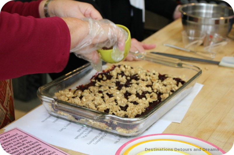 Adding crumble to the olallieberry bars