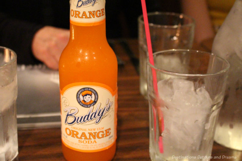A bottle of Buddy's orange soda