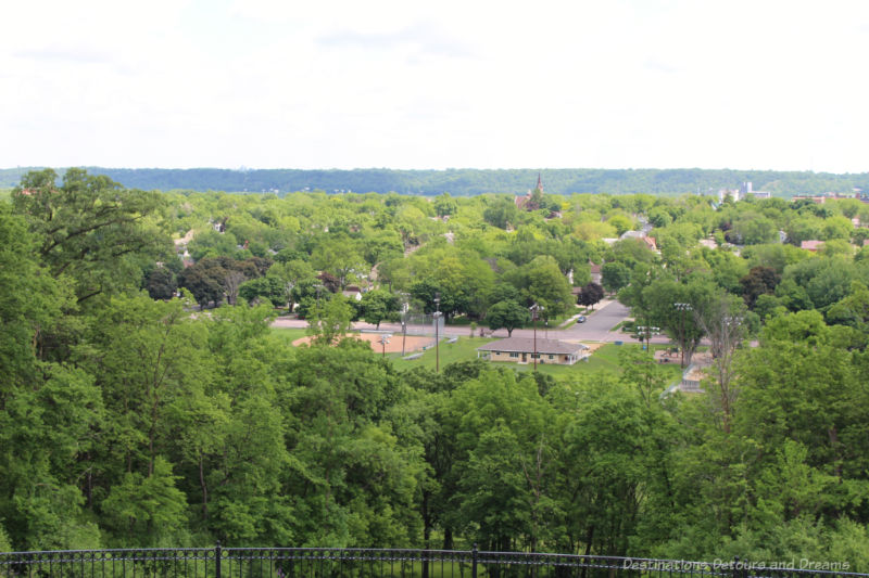 View of the town of New Ulm amid the green of trees from Hermann Heights Park