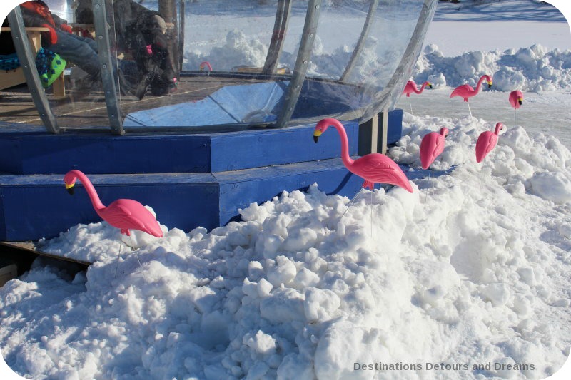 Flamingos surround a warming hut along the Red River Mutual Skating Trail in Winnipeg, Manitoba