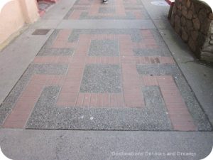 Shou symbol on sidewalk in Canada's oldest Chinatown, Victoria British Columbia