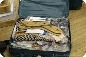 The suitcases contain materials which focus on aspects of textiles and clothing history which are designed for educational levels from primary through secondary levels - Museum in a Suitcase program
