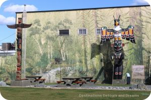 Totem poles and a mural in Duncan, British Columbia (the City of Totems)