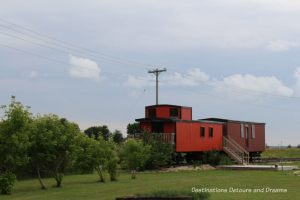 Train at Arborg and District Multicultural Heritage Village,where restored buildings preserve the past.