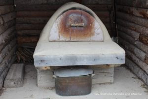 Ukrainian bake oven at Arborg and District Multicultural Heritage Village,where restored buildings preserve Manitoba's past.