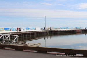 Gimli Seawall Gallery, a collection of murals on a protective wall on the pier, is a favourite tourist attraction in Gimli, Manitoba