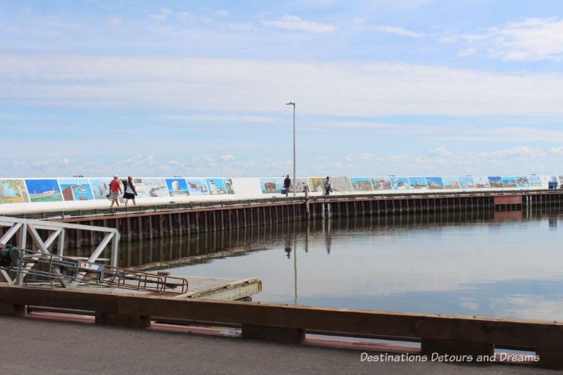 Gimli Seawall Gallery, a collection of murals on a protective wall on the pier, is a favourite tourist attraction in Gimli, Manitoba