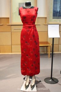 Chinese red silk brocade gown from 1959. Dressing Up: Celebrating Canada's New Years Through The Decades. Highlights from the Eve of Elegance Exhibit by the Costume Museum of Canada.
