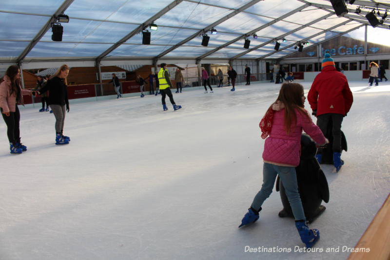 Ice rink at Winchester Christmas Market: A traditional German-style Christmas market on the grounds of historic Winchester Cathedral