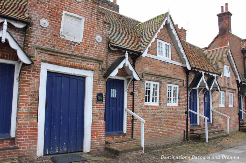 Almshouses in Farnham. History and British Charm in Farnham. Farnham is a historic British market town located on the western edges of Surrey in the rolling Surrey Hills. It is known for its Georgian streets, historic buildings, craft heritage, and easy access to the North Downs Way.