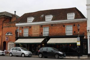 Ghost sign on Castle Street.History and British Charm in Farnham. Farnham is a historic British market town located on the western edges of Surrey in the rolling Surrey Hills. It is known for its Georgian streets, historic buildings, craft heritage, and easy access to the North Downs Way.