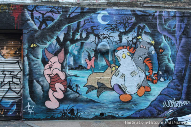 London street art in Shoreditch: cartoon characters in eerie night forest