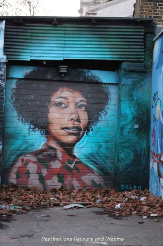 London street art in Brick Lane; painting of Myvanwy by Dreph,who protrrays the lives of strong, black women