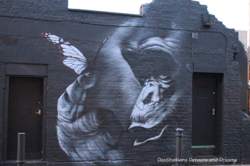 London street art in Brick Lane: grey-scale gorilla by Trafik