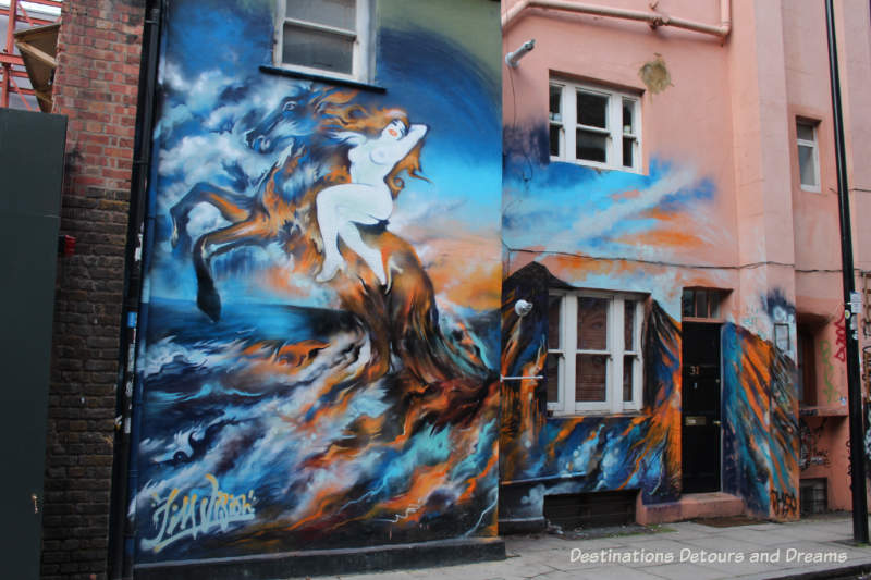 London street art in Shoreditch: woman on horse by Jim Vision