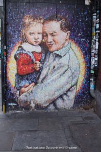 London street art in Brick Lane: man and child (Joe's Kid) by Jimmy C