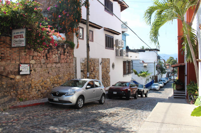 The Colourful Architecture and History of Gringo Gulch, Puerto Vallarta, Mexico: cobblestoned street and Chez Elena