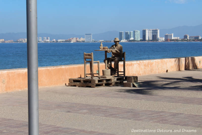 Strolling the Puerto Vallarta Malecón: living statue imitating a sand statue