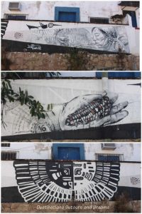 Puerto Vallarta street art: three black and white indigenous-themed pieces: an elder, a hand holding a cob of corn and a half-circular design