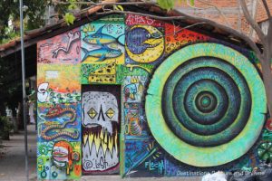 Puerto Vallarta street art: an eclectic collection of graffiti-like swirls on a building in the Romantic Zone