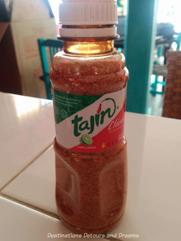A jar of tajin seasoning; a popular {uerto Vallarta spice
