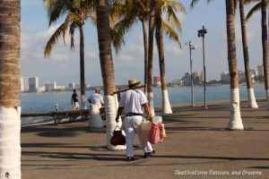 Vendor selling tuba along Puerto Vallarta's Malecón