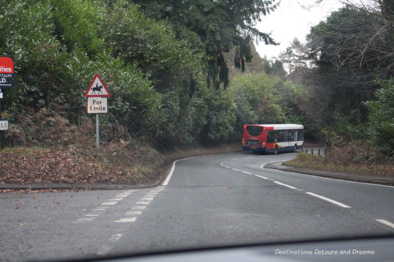 Bus on a country road in eastern Surrey, England Bus on a country road in eastern Surrey, England