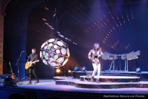 William Close of the Earth Harp Collective wearing the Drum Jacket on stage