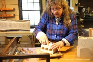 Woodcarver Pam Greesham carving at Silver Dollar City