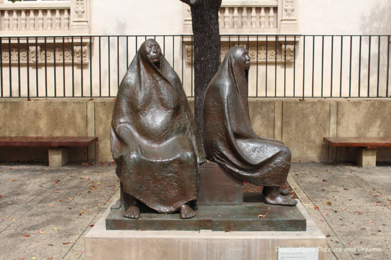 "Mother and Daughter Seated" sculpture