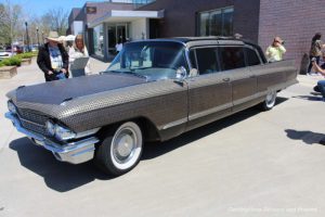 Making Change art installation by Monica Mahoney is a 1962 Cadillac covered with dimes, nickels, and pennies