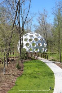 "Buckyball" sculpture by Leo Villareal- a white dome covered in holes