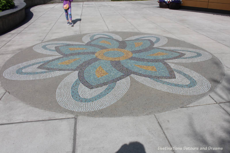 Mosaic design on sidewalk in front of Morris Thompson Cultural and Visitor Center in Fairbanks, Alaska