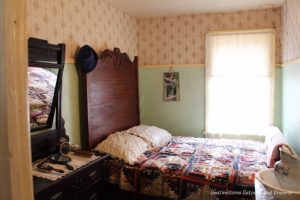 Bedroom in Hazel Cottage at Nellie McClung Heritage Site