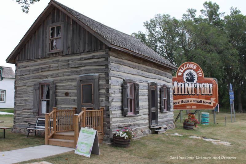 log cabin Manitou Tourism Centre