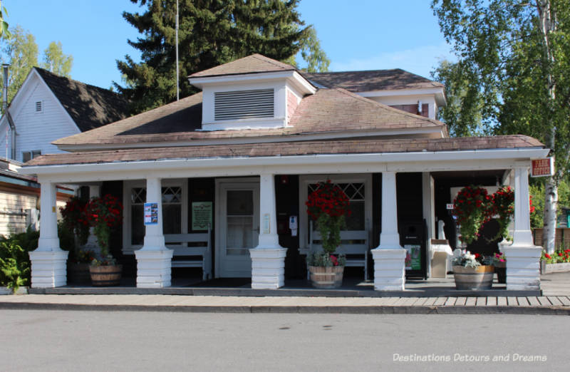 Georgia Lee House with covered front porch and decorative pillars in Pioneer Park in Fairbanks, Alaska