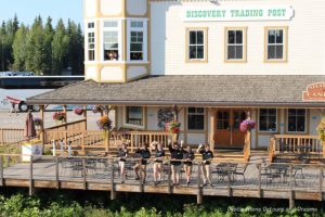 Staff waving us off as we being our sternwheeler excursion aboard the Riverboat Discovery in Fairbanks, Alaska