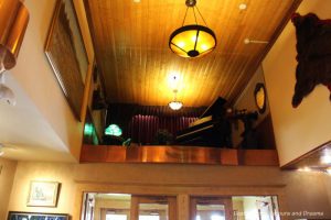 Grand piano in an elevated nook in the lobby of Pike's Waterfront Lodge in Fairbanks, Alaska
