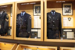 Displays of pre-amalgamation community police forces at Winnipeg Police Museum