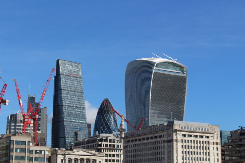 Three twenty-first century buildings in London's skyline: buildings nicknamed the Cheesgrater, the Gherkin, and the Walkie-Talkie.