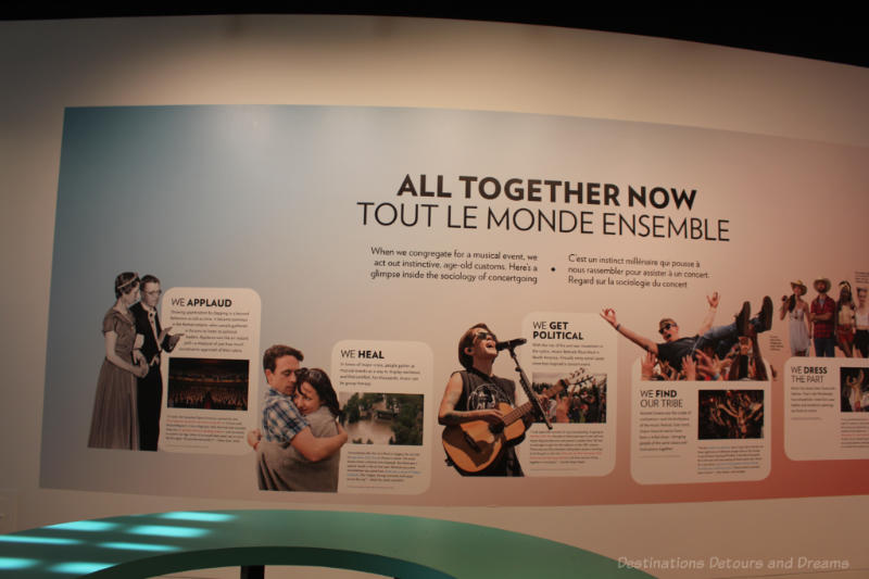 Wall at Studio Bell National Music Centre outlining how we get together with music (applaud, heal, political, find our tribe)