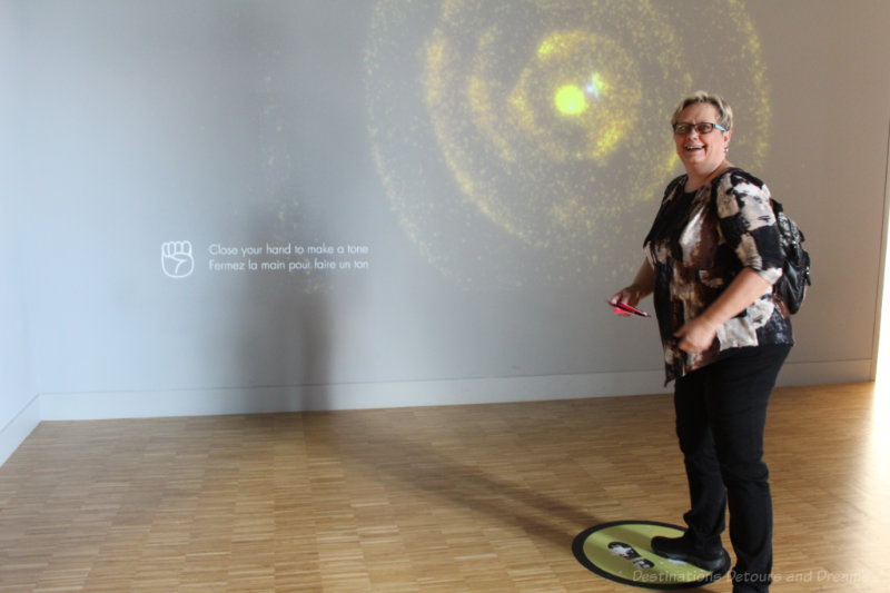 Standing in the National Music Centre Bodyphonic gallery, where you see sound move by controlling the tone with your hands and feet