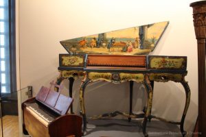 1890 Harmonium and 1560 colourfully decorated Virginal