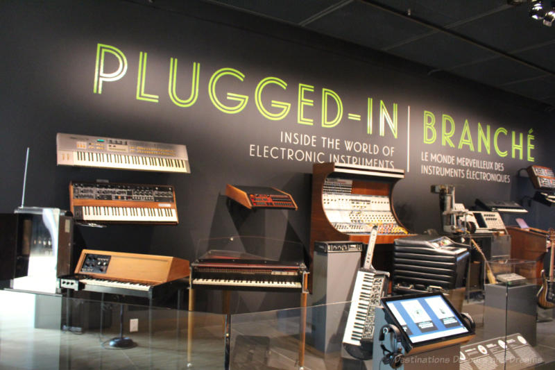 A group of electronic instruments and synthesizers in the Plugged In gallery at National Music Centre
