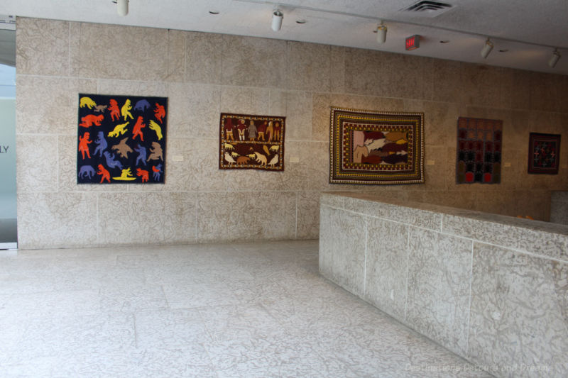 Inuit wall hangings in the Tyndall stone lobby area of the gallery level of the Winnipeg Art Gallery